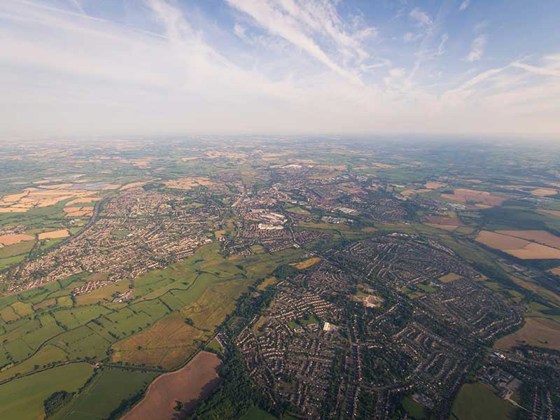 Surveyor working on completeing a building condition report